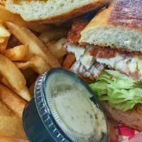 Fish Sandwich · Deep fried (8 oz Tilapia filet fish), Lettuce, tomatoes, mayo,American Cheese and fries.