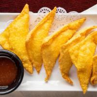 Crab Cheese Wontons · 6 pcs fried cheese stuffed wontons served with sweet chili sauce