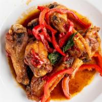 Spicy Thai Chicken Wings · Crispy chicken wings sauteed with spicy thai basil sauce