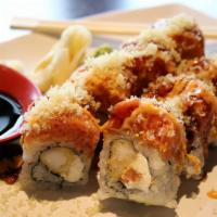 Dynamite Roll · Shrimp tempura,cream cheese inside, topped with spicy tuna and tempura bits,drizzled with ee...