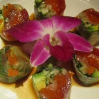 Summer Roll · Tuna,salmon,yellowtail,cucumber,avocado,cilantro wrapped in rice paper topped with massago a...