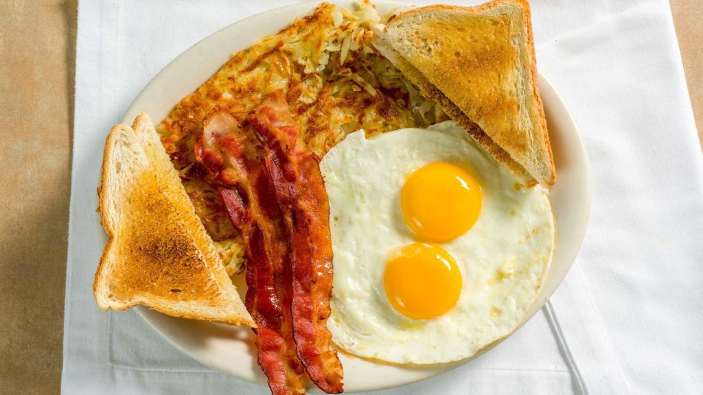 The Classic Breakfast · Two eggs any style, choice of bacon, sausage links, sausage patties, turkey patties, or ham, homemade hashbrowns, toast, and jelly.