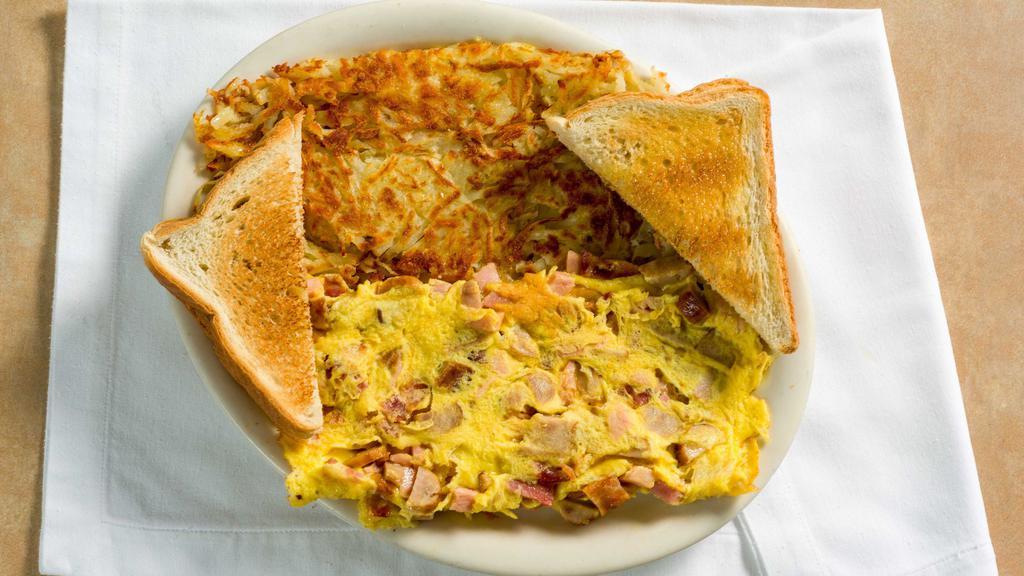 Hungry Man Omelette · Three egg omelette with ham, sausage, bacon, and american cheese. Served with homemade hashbrowns, and toast and jelly.