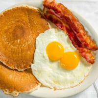 Pancakes ‘N’ Eggs ‘N’ Meat Breakfast · Two eggs any style, two pancakes, and choice of bacon, sausage links, ham, sausage patties, ...
