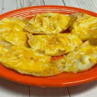 Cheese Nachos · Chips topped with melted cheese.