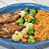 Pollo Chulo · Grilled boneless chicken breast served with vegetables mix and rice on the side.