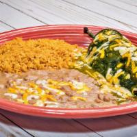 Poblano Relleno · Poblano relleno with beef, chicken or cheese with verde sauce and cheese on top. Served with...