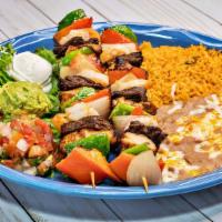 Brochetas · Two brochetas filled with steak, chicken, shrimp, bell pepper and onions. Served with guacam...