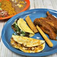 Amigo Plate · Three pork ribs, one asada taco, two flautas and one quesadilla. Served with guacamole, sour...