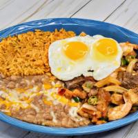 Guiso Ranchero · Tender cuts of beef, chicken or shrimp fajita cooked with onions, tomatoes, jalapeños. Serve...