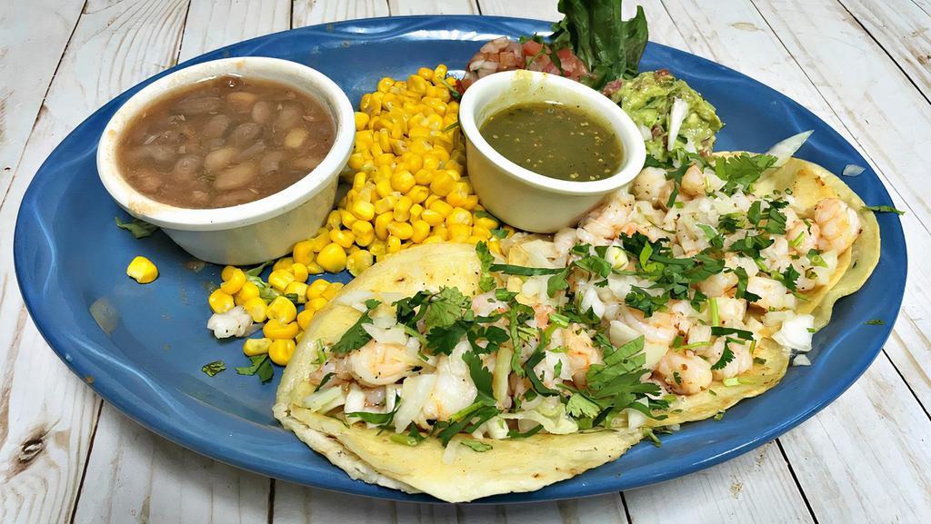 Shrimp Tacos · 3 shrimp tacos with onion, cilantro, pico de gallo and guacamole. Served with two sides.