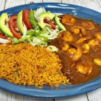 Camarón A La Diabla · Shrimp cooked in our special hot red diabla sauce. Served with rice and salad.