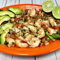 Ceviche De Camarón · Shrimp cooked in lemon juice with onions, tomatoes, cilantro, avocado and jalapeños.