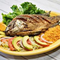 Mojarra Frita · Fried whole fish. Served with rice and salad.