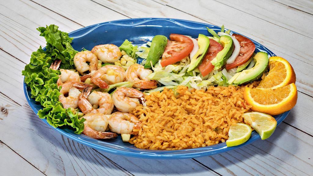 Camaron Al Mojo De Ajo · Shrimp cooked in our special garlic sauce. Served with rice and salad.