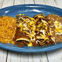 Enchilada Dinner · Two cheese, beef or chicken enchiladas with your preferred sauce, and cheese. Served with tw...