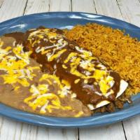 Burrito Dinner · Big flour tortilla with beef or chicken, with your preferred sauce and cheese on top. Served...