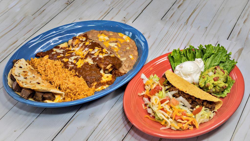 Caliente Plate · One quesadilla, one enchilada, one tamale and one taco with guacamole and sour cream. Served with two sides.