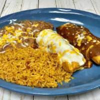 Tamale Dinner · Two tamales with your choice of pork or chicken with your preferred sauce and cheese on top,...