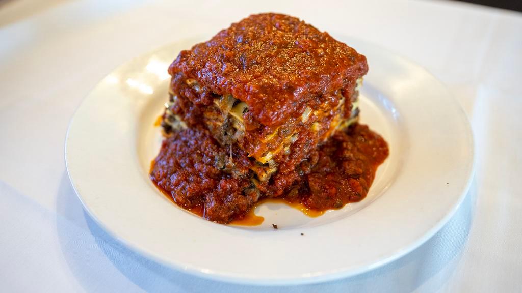 Lasagna · Layers of pasta baked with mozzarella, ricotta and parmigiano cheese in our rich tomato meat sauce