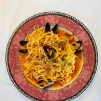 Linguini Frutti Di Mare · A blend of shrimp, calamari, scallops, clams and mussels sautéed in a light red tomato basil...