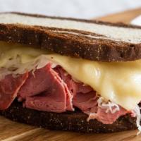 Reuben · Slow cooked corned beef, kraut, swiss and Thousand island on toasted marble rye.