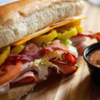 The Bandit · Turkey, ham, bacon, cheddar, provolone, banana peppers, a BBQ ranch garlic sauce, lettuce, t...