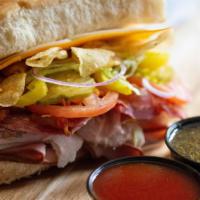 Super Bomber · Roast beef, salami, bacon, turkey, ham, provolone, cheddar, kettle chips, banana peppers, Fr...
