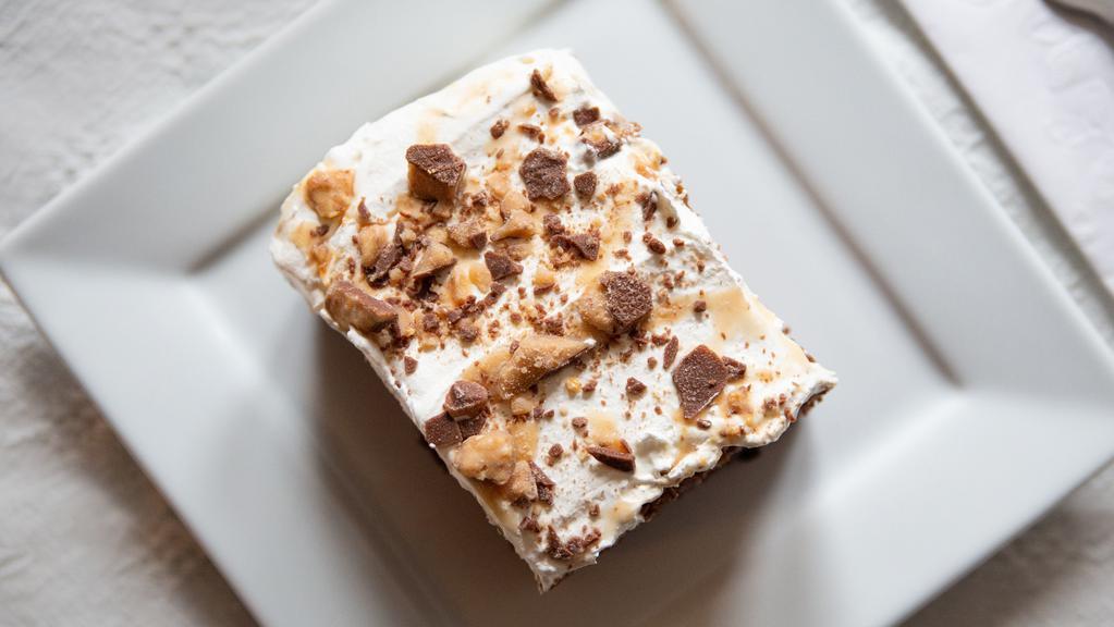 Break Up Cake · German chocolate cake, caramel, butterscotch topping, cool whip and heath bar bits.