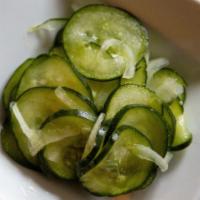 Regular Cucumber Salad · Cucumbers, onions, vinegar and sugar mixed together for a burst of freshness.  Just the righ...