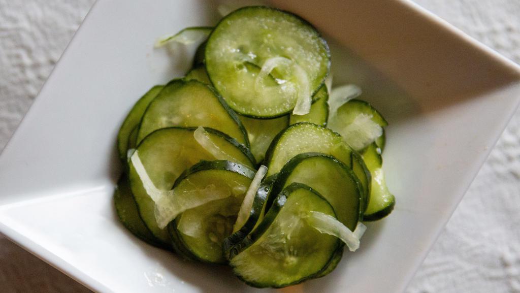 Regular Cucumber Salad · Cucumbers, onions, vinegar and sugar mixed together for a burst of freshness.  Just the right balance of sweet and tangy!