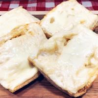 Garlic Cheese Bread · House-baked bread with garlic butter AND mozzarella cheese.