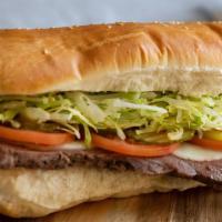 Prime Rib Steak Sub · In house cooked 7 oz. piece of prime rib steak with melted provolone and the standard toppin...