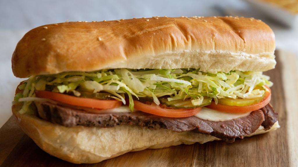 Prime Rib Steak Sub · In house cooked 7 oz. piece of prime rib steak with melted provolone and the standard toppings served on our 8