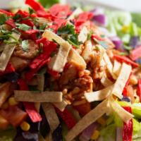 Bbq Chicken Southwest Salad · Chopped chicken tossed in BBQ sauce, cheddar jack cheese, corn, cilantro, tomato, onion and ...