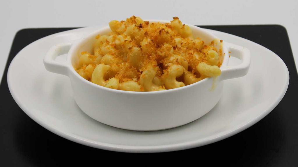 Kids' Macaroni & Cheese · Classic macaroni and cheese served with a piece of buttered bread
