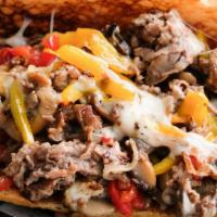 Philly Cheesesteak · thinly sliced sirloin, red and yellow peppers, onions, mushrooms, mozzarella.