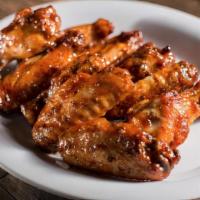 Jumbo Wings · Oven baked and tossed in your choice of sauce. Served with dressing on the side.