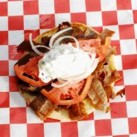 Gyros · Classic, slow roasted lamb with tzatziki, onions, and tomato served on a warm pita.