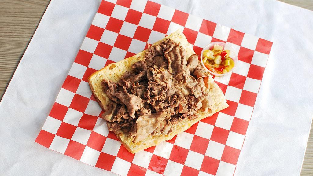 Italian Beef · Thinly Sliced roast beef, simmered and slow-cooked, served with giardiniera, au jus, and sweet green peppers.