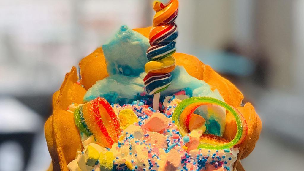 Unicorn Bubble Waffle · Vanilla gelato with cotton candy, unicorn sprinkles, marshmallows, rainbow ears and lollipop horn served in a delicious bubble waffle.