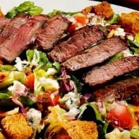 Steakhouse · Salad or roasted tomato wrap with seared flat iron steak, sweet red peppers, slow roasted ye...