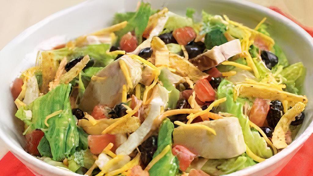 South West · Salad or roasted tomato wrap with all-natural antibiotic-free chicken, avocado, black beans, corn, tomatoes, peppadew peppers, crispy tortilla chips, queso blanco cheese, romaine lettuce served with chipotle lime dressing.