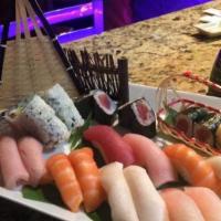 Sushi & Sashimi Combo · Five pcs of sushi, nine pcs of chef's choice sashimi and one California roll.