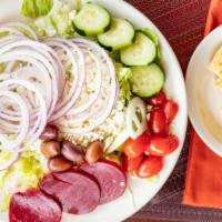 Small Greek Salad · Tomatoes cucumber onion and olives.