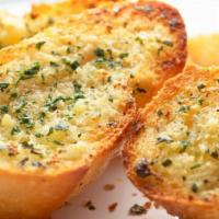 Garlic Cheesebread · Soft new York dough brushed with garlic butter and topped with a blend of mozzarella and Par...