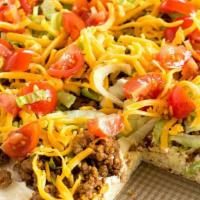 Taco Pizza · You'll say ole to our classic taco pizza - taco meat, cheddar and mozzarella cheeses, lettuc...