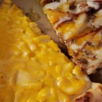 Mac & Cheese Pizza · Creamy mac and cheese, topped with parmesan and cheddar cheese.