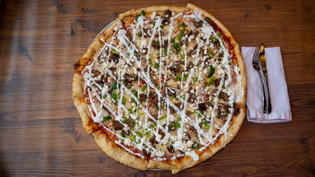 Gyro Pizza · Tomato sauce, mozzarella cheese, gyro meat, onions, green pepper, kalamata olives, feta cheese and our famous cucumber sauce.