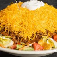 Chili Salad · Mixed greens topped with chili, Cheddar cheese, sour cream, tomatoes, and Fritos corn chips....